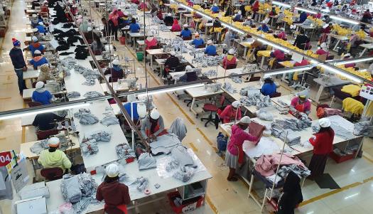 Decorative image of textile workers in a free zone in Antananarivo, Madagascar. ILO Photo.  